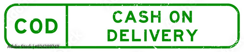 Grunge green COD cash on delivery word square rubber seal stamp on white background