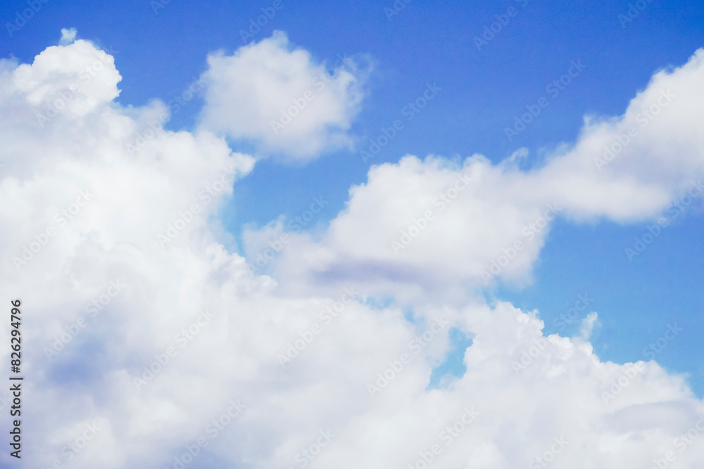Fototapeta premium Scenic view of fluffy white clouds over Tumon Beach, Guam, USA