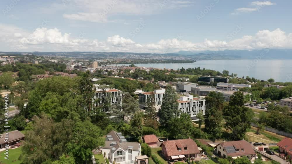 Aerial of beautiful apartment complex surrounded by a green park near Lake Geneva in Switzerland Aerial of beautiful apartment complex surrounded by a green park near Lake Geneva in Switzerland