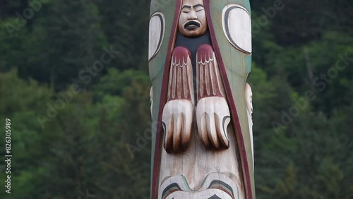 Closeup shot of a Native American wooden totem pole in Juneau, capital of Alaska, United States photo