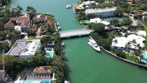 Drone shot over Biscayne Bay with a bridge and houses