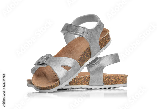 Women's summer shiny sandals isolated on a white background.
