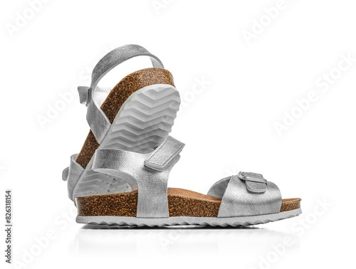 Women's summer shiny sandals isolated on a white background.