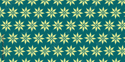 Pattern with blooming flower motifs on a green background