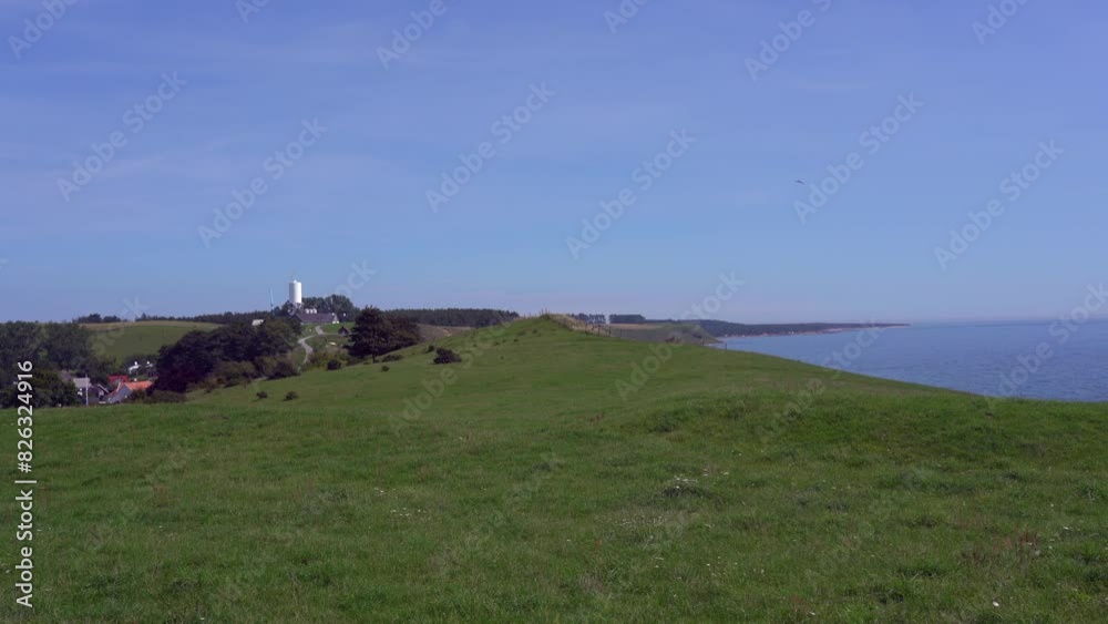 Grassy coastal cliff on the coast of the Baltic Sea on a sunny day in Malmo, Sweden Grassy coastal cliff on the coast of the Baltic Sea on a sunny day in Malmo, Sweden