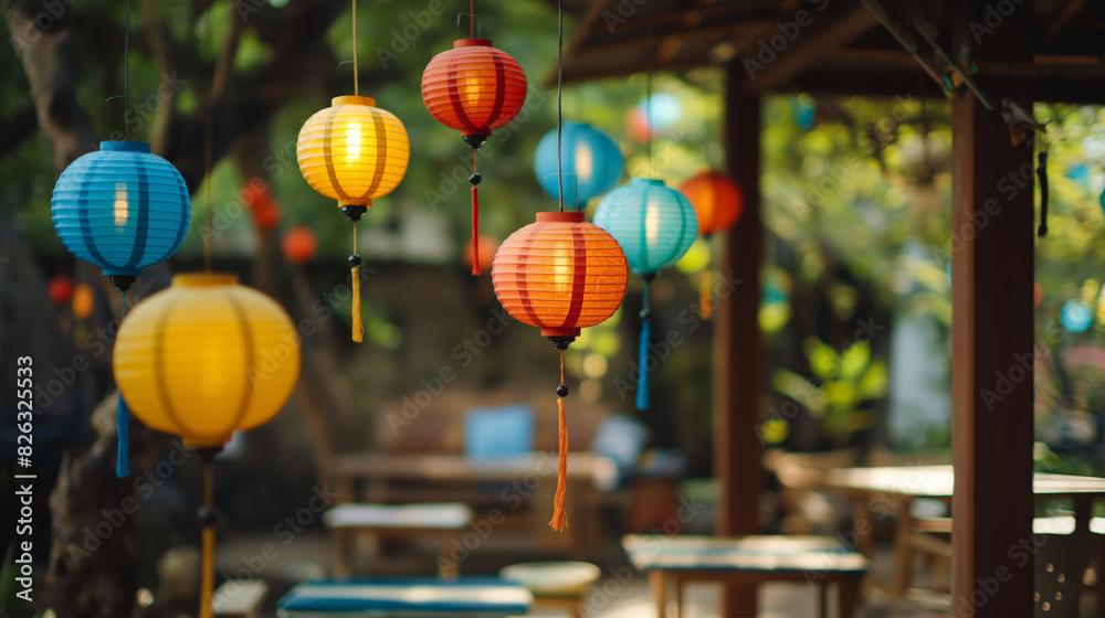 Fototapeta premium Stunning display of hanging colorful paper lanterns against a bokeh background