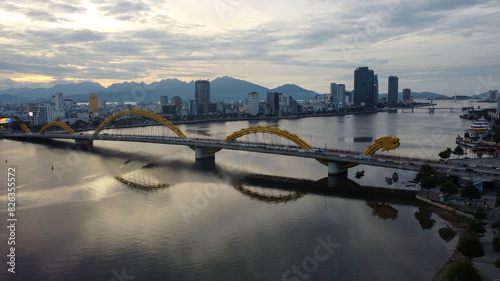 Aerial view of Dragon Bridge at sunset which is a very famous destination of Da Nang city photo