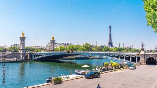 A timelapse of the Eiffel Tower along the river Seine with flyboats passing by with motion blur.Sunny but cloudy spring summer day paris city famous riverside bay tower view bridge timelapse panorama