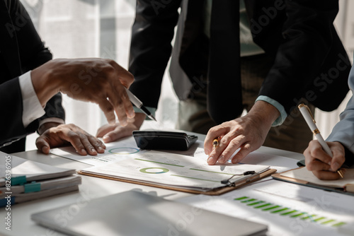 a group of businesspeople is discussing about new project that is coming up soon, those employees is shearing their idea to each other to choose the best strategy