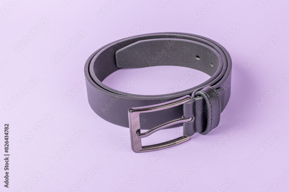 Elegant Black Leather Belt with Silver Buckle on Purple Background Elegant Black Leather Belt with Silver Buckle on Purple Background