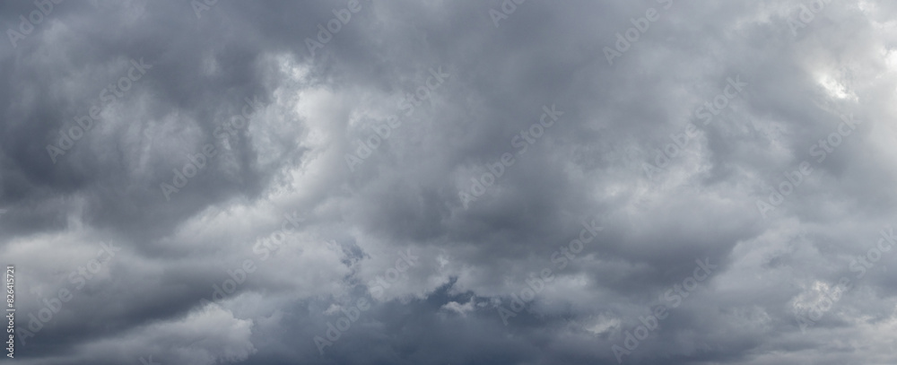 A stormy sky with thick gray clouds before a thunderstorm A stormy sky with thick gray clouds before a thunderstorm