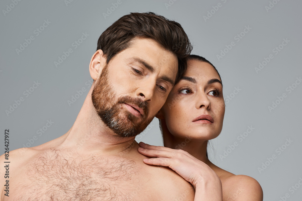 A man and a woman lovingly pose together. A man and a woman lovingly pose together.