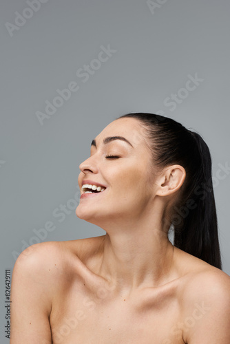 A smiling woman closed eyes.