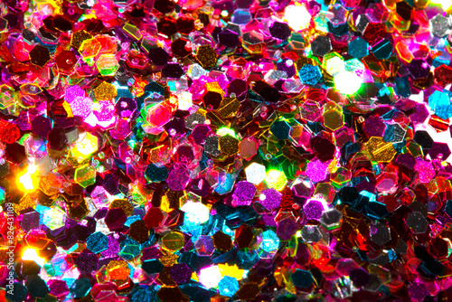 Close Up of Color Shiny Confetti Glitter On White Background © squeebcreative