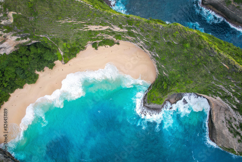 Aerial view of sandy beach with blue ocean waves, Kelingking Beach, Bali, Indonesia. photo