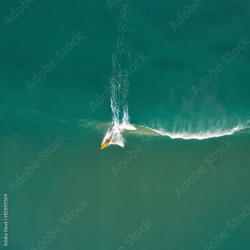 Aerial view of surfers paradise with kneeboarder and surfer, gold coast, australia. photo