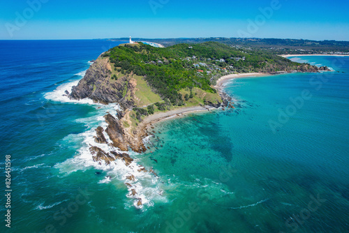 Aerial view of beautiful sandy beach and blue ocean at Cape Byron State Conservation Area, Byron Bay, Australia.