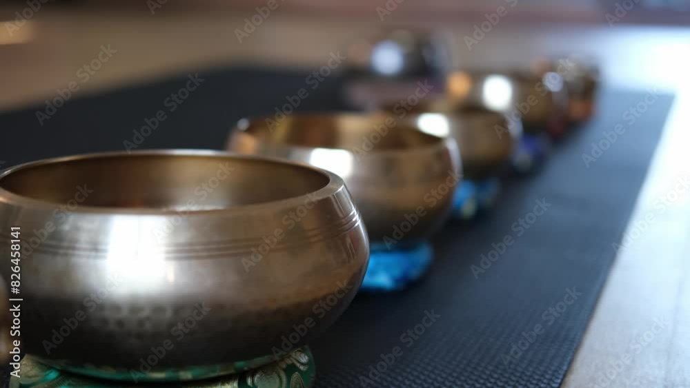 4 K video. an accessory for mindfulness or meditation. Yoga, Tibetan musical bowls and on the floor, with space to copy. Harmony with yourself and the world.