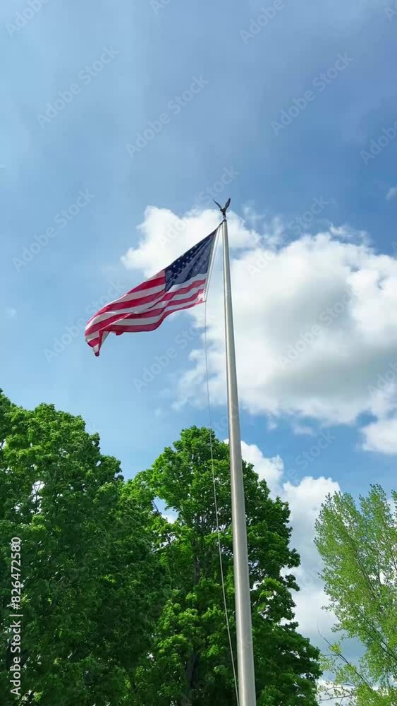 Vertical video of United States American flag Old Glory red white and blue stars and stripes waving on the forth of July Vertical video of United States American flag Old Glory red white and blue stars and stripes waving on the forth of July