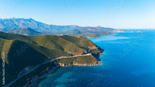 Aerial drone view of a road leading along the North coast of Corsica island, France. photo