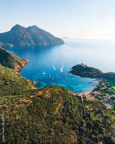 Aerial drone view of Girolata, coastal town and fort on the island of Corsica, France.