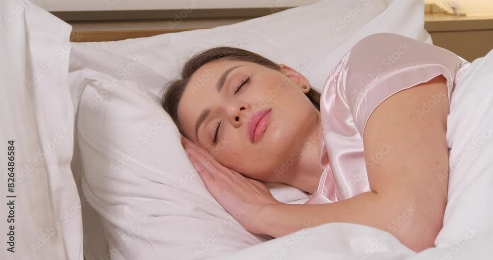 Beautiful woman sleeping in bed. Camera moving towards her Beautiful woman sleeping in bed. Camera moving towards her