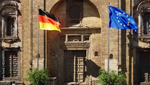 Parete storica con bandiera Germania e bandiera Unione Europea photo