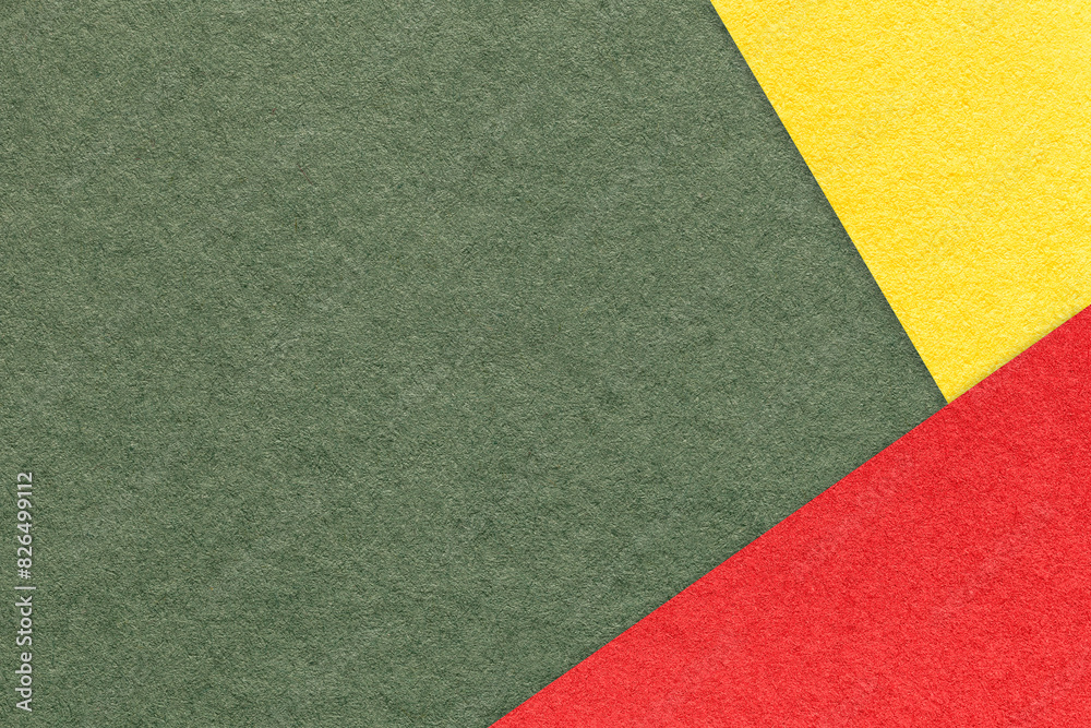 Texture of craft olive color paper background with yellow and red border. Vintage abstract green cardboard. Texture of craft olive color paper background with yellow and red border. Vintage abstract green cardboard.