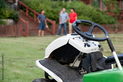 View of the lawn mower on the grass field