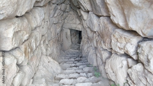 Archaeological site of ancient citadel of Mycenae , north-eastern Peloponnese, Greece - Greek settlement of the 12th century BC. e. with the ruins of the acropolis Agamennone / STONE  CAVE  photo