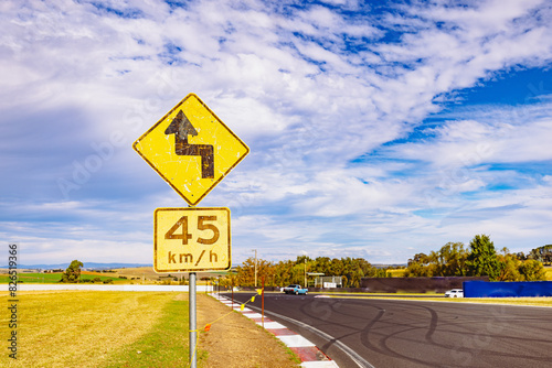 Winding road warning sign on the Mount Panorama racing circuit public road photo