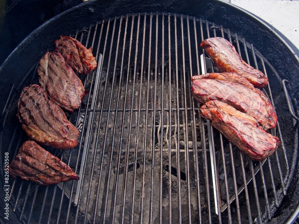 Sirloin cap steaks, also called picanha, smoked and grilled on the old-fashioned kettle charcoal grill