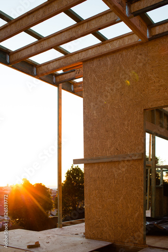 wooden frame of granny flat second dwelling under construction in backyard