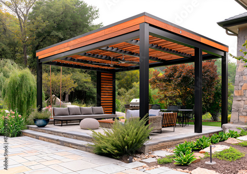 Freestanding outdoor pergola made with steel structure and wooden details. Positioned on a stone patio.