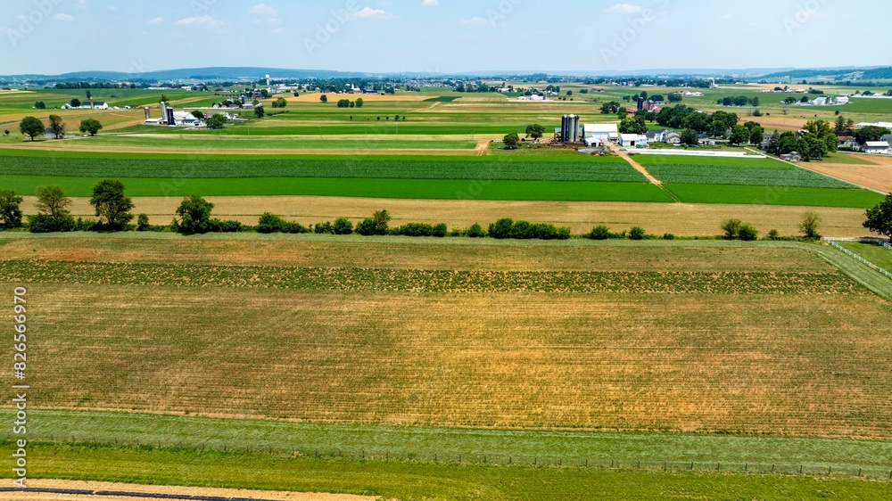 An Aerial View of Farmland with Varied Crops and Fields