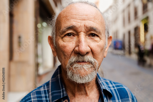 Portrait of elderly man looking into the camera - Retired people concept