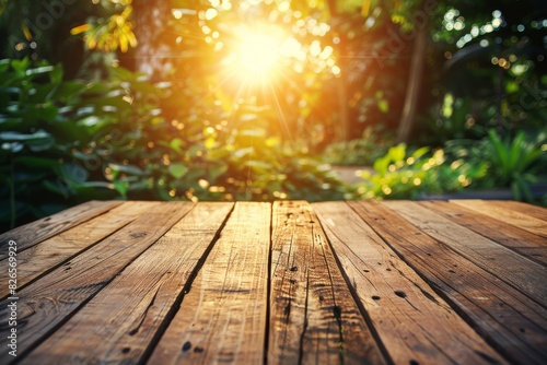 An empty rustic wooden plank table top with a blurred background of a lush jungle  providing ample copy space