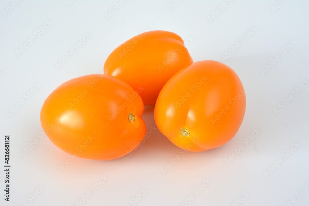 three ripe tomatoes are shown on a white background three ripe tomatoes are shown on a white background