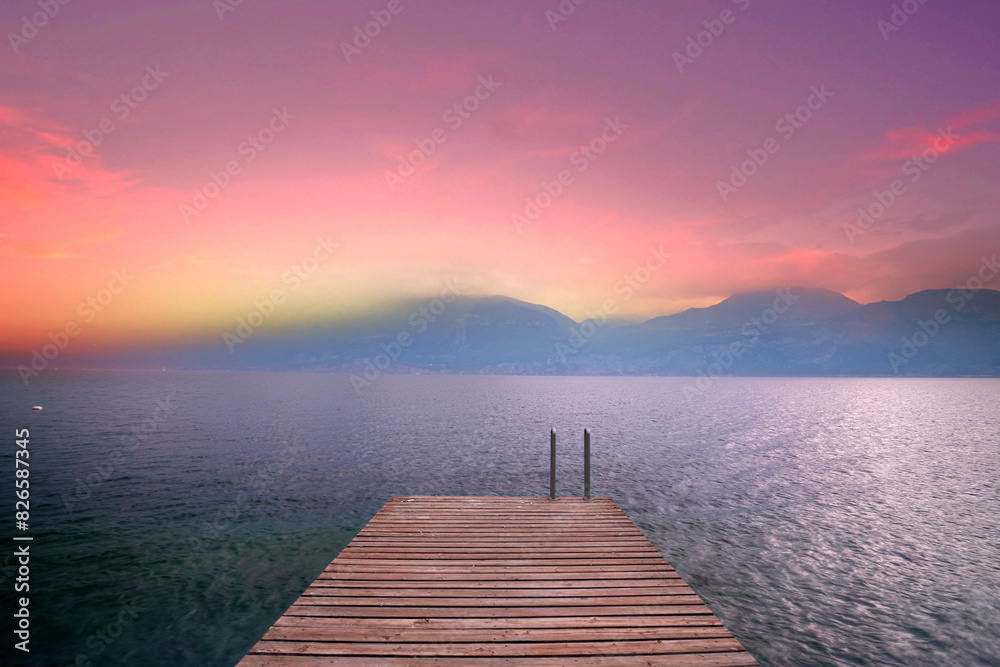 calm sunset on the wooden pier in mountains