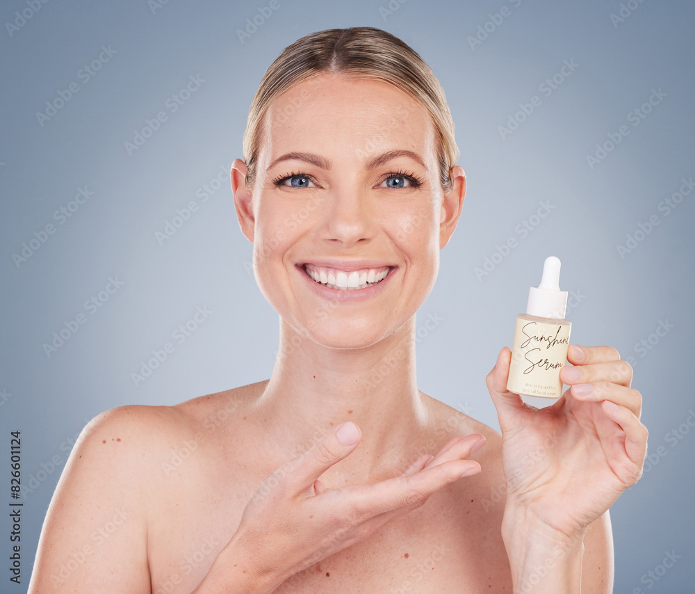 Woman, portrait and smile with serum bottle for skincare in studio on grey background with routine, ingredients. Girl, natural and confidence with facial treatment, skin product and happy for results Woman, portrait and smile with serum bottle for skincare in studio on grey background with routine, ingredients. Girl, natural and confidence with facial treatment, skin product and happy for results