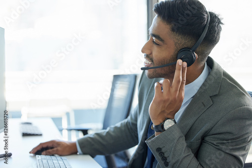 Call center, talking and man with headset in office for communication, customer support or service. Contact us, CRM and male consultant at desk for student aid, career guidance or scholarship advice photo