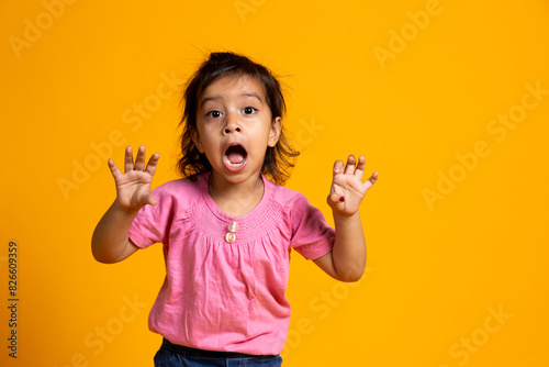 Beautiful Caucasian young girl standing against yellow background scared . Human emotions, facial expression concept. scare , fear