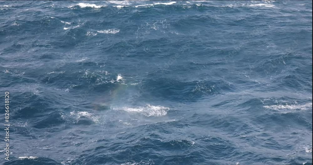 4k UHD slow motion waves, breakers and swell in the blue ocean on a windy day looking over the side of a ship 4k UHD slow motion waves, breakers and swell in the blue ocean on a windy day looking over the side of a ship
