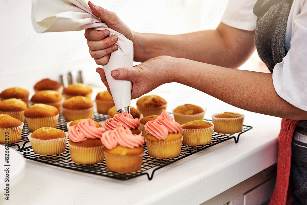 Person, baker and cupcake in kitchen and frosting, start up and business with employee for treat or dessert. Creative, icing and order preparation for customer, bakery and apron and party bag