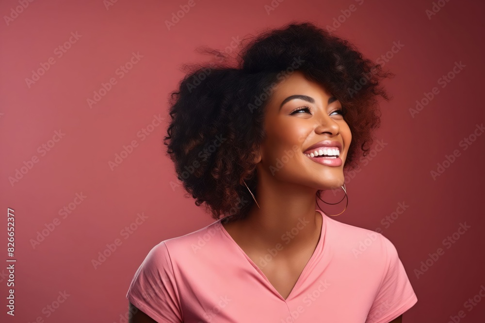 A smiling woman with curly hair. A smiling woman with curly hair.