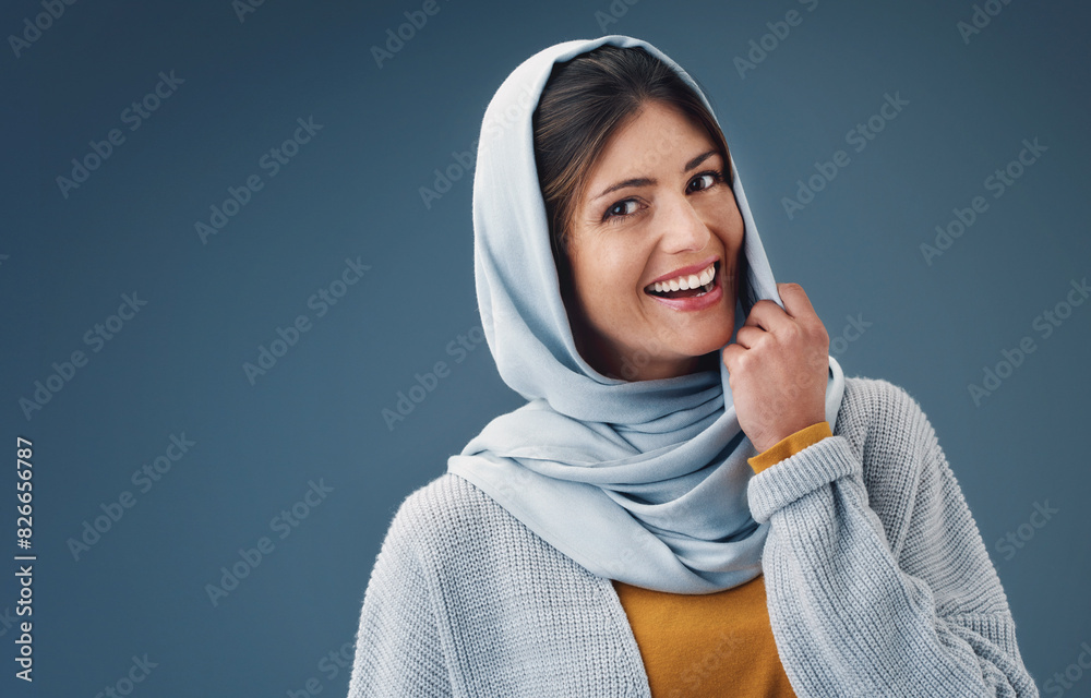 Woman, studio and smile with hijab in portrait with happy for confidence for islamic culture. Faith, beauty and pride with blue background for arab people with religion, middle east and natural Woman, studio and smile with hijab in portrait with happy for confidence for islamic culture. Faith, beauty and pride with blue background for arab people with religion, middle east and natural