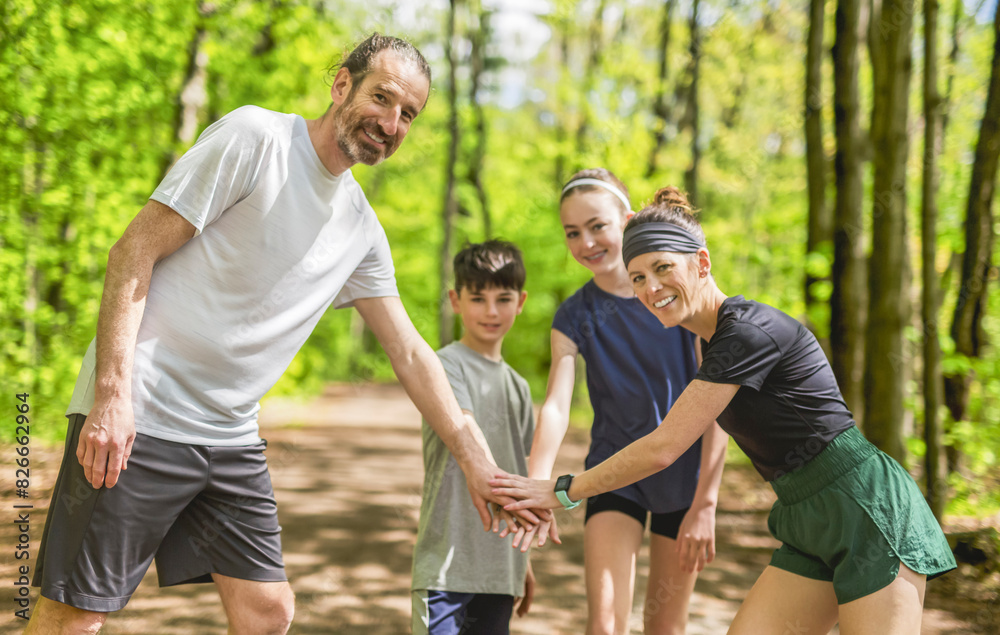 A Family exercising and jogging together at an outdoor park hand on hand A Family exercising and jogging together at an outdoor park hand on hand