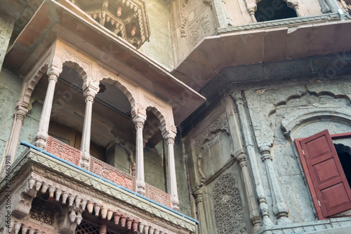 Carved Arches & Windows of fort wall of Rajwada, Indore, Madhya Pradesh. Also known as the Holkar Palace or Old Palace. Indian Architecture.