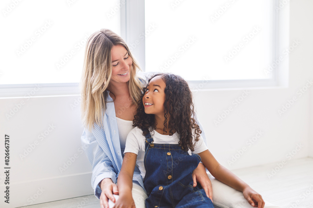 An Adorable black american little girl with her mother on studio An Adorable black american little girl with her mother on studio