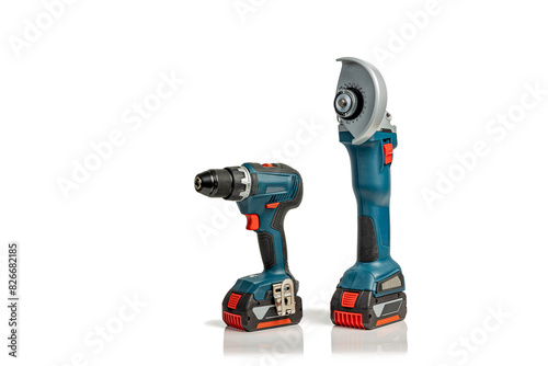 Professional cordless drill driver and angle grinder power tools isolated on a white background with copy space; instruments for DIY or trade isolated on white; drill and angle grinder side view.